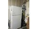 Storage space in the garage with a refrigerator and water heater at 5466 Scotch Cap Dr, Las Vegas, NV 89122