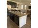 Kitchen island features granite counters, stainless steel appliances, and ample storage space at 5466 Scotch Cap Dr, Las Vegas, NV 89122