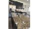 Elegant kitchen island features stainless sink and gooseneck faucet plus generous granite countertop space at 5466 Scotch Cap Dr, Las Vegas, NV 89122