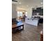 Modern kitchen open to the living area, features dark cabinets, island and stainless appliances at 5466 Scotch Cap Dr, Las Vegas, NV 89122