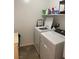 Bright laundry room with modern washer and dryer at 5466 Scotch Cap Dr, Las Vegas, NV 89122