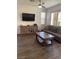 Comfortable living room features modern tile flooring, neutral decor, and plenty of natural light at 5466 Scotch Cap Dr, Las Vegas, NV 89122