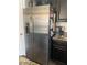 Stainless steel side-by-side refrigerator with a water dispenser at 5466 Scotch Cap Dr, Las Vegas, NV 89122