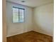 Simple carpeted bedroom with a window offering natural light, and blank walls ready for personal touches at 5653 Nobleton Ct, North Las Vegas, NV 89081