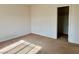 Carpeted bedroom featuring ample space, natural light, and closet access at 5653 Nobleton Ct, North Las Vegas, NV 89081