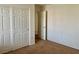 Bedroom with closet and doorway, featuring neutral carpet at 5653 Nobleton Ct, North Las Vegas, NV 89081