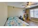 Well-lit bedroom with wood floors, ceiling fan, and a comfortable, inviting atmosphere at 5710 E Tropicana Ave # 2218, Las Vegas, NV 89122
