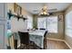 A charming dining room features wood floors and a window providing natural light at 5710 E Tropicana Ave # 2218, Las Vegas, NV 89122