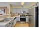 Functional kitchen showcasing stainless steel appliances, ample counter space, and a convenient layout at 5710 E Tropicana Ave # 2218, Las Vegas, NV 89122