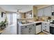Open kitchen design flowing into the living area, featuring modern appliances and stylish finishes at 5710 E Tropicana Ave # 2218, Las Vegas, NV 89122
