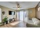 Living room features sleek flooring, ample natural light, and functional furnishings at 5710 E Tropicana Ave # 2218, Las Vegas, NV 89122
