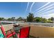 Outdoor patio with seating and grill; neighborhood view at 5710 E Tropicana Ave # 2218, Las Vegas, NV 89122