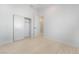 Minimalist bedroom featuring a closet with sliding doors, bright neutral walls and light wooden floors at 60 Pecos St, Las Vegas, NV 89110