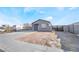 Charming single-story home with desert landscaping, new driveway, and contemporary block wall fencing at 60 Pecos St, Las Vegas, NV 89110