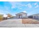 Charming single-story home featuring desert landscaping, a new driveway, and block wall fencing at 60 Pecos St, Las Vegas, NV 89110