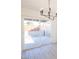 View of the backyard with sliding glass door and modern lighting at 6170 W University Ave, Las Vegas, NV 89103