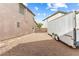 Gravel lot shows room to park trailer in backyard at 623 Blue Snow River Ct, Henderson, NV 89002