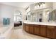 The primary bathroom has a double sink vanity, soaking tub, and walk-in shower at 623 Blue Snow River Ct, Henderson, NV 89002