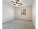 Bedroom featuring carpeted floors, ceiling fan, and a large window at 623 Blue Snow River Ct, Henderson, NV 89002