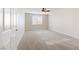 Bedroom featuring carpeted floors, ceiling fan, and large window at 623 Blue Snow River Ct, Henderson, NV 89002