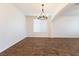 Bright dining room with wood floors and a modern chandelier, creating an elegant and inviting space at 623 Blue Snow River Ct, Henderson, NV 89002