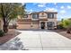 Charming two-story home featuring a three-car garage, landscaped yard, and inviting entrance at 623 Blue Snow River Ct, Henderson, NV 89002