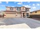 Two-story home featuring a three-car garage and tile roof at 623 Blue Snow River Ct, Henderson, NV 89002