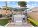 Backyard hot tub features a gazebo and stone landscaping at 623 Blue Snow River Ct, Henderson, NV 89002