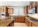 Granite countertops, stainless steel appliances, and lots of cabinets in this well-equipped kitchen at 623 Blue Snow River Ct, Henderson, NV 89002