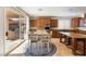 A spacious kitchen features an island and a dining area with outdoor access at 623 Blue Snow River Ct, Henderson, NV 89002