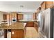 Open kitchen with granite countertops, island, stainless steel appliances, and lots of cabinets at 623 Blue Snow River Ct, Henderson, NV 89002
