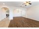 Spacious living room featuring wood floors and arched doorways for an open and inviting atmosphere at 623 Blue Snow River Ct, Henderson, NV 89002