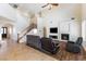 Bright living room featuring a fireplace, comfortable seating, and abundant natural light at 623 Blue Snow River Ct, Henderson, NV 89002
