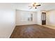 Empty room with hardwood floors, large windows, and bright, neutral walls at 623 Blue Snow River Ct, Henderson, NV 89002
