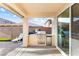 Outdoor kitchen with stainless steel grill and counter space at 623 Blue Snow River Ct, Henderson, NV 89002
