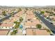 A high aerial view of a neighborhood, highlighting the community pool and residential architecture at 628 Carlos Julio Ave, North Las Vegas, NV 89031
