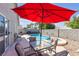 Private backyard features a beautiful pool, spa, and patio area at 628 Carlos Julio Ave, North Las Vegas, NV 89031