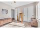 Bright bedroom with ample closet space and a neutral color scheme, creating a serene and comfortable retreat at 628 Carlos Julio Ave, North Las Vegas, NV 89031