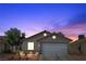 Charming single-story home with a two-car garage and well-maintained landscaping at 628 Carlos Julio Ave, North Las Vegas, NV 89031
