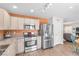 Modern kitchen with stainless steel appliances, granite countertops, and ample cabinet space at 628 Carlos Julio Ave, North Las Vegas, NV 89031