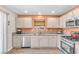 The kitchen features updated appliances, granite countertops, and updated hardware at 628 Carlos Julio Ave, North Las Vegas, NV 89031