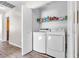 Convenient laundry room with modern washer and dryer units, maximizing efficiency and space at 628 Carlos Julio Ave, North Las Vegas, NV 89031