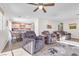 Inviting living room with plush recliners, eat in kitchen and wood look floors at 628 Carlos Julio Ave, North Las Vegas, NV 89031