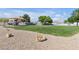 Community playground area with covered seating, a lawn, and play equipment for Gathering fun at 628 Carlos Julio Ave, North Las Vegas, NV 89031