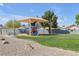 Well-maintained playground featuring play equipment, a picnic table, and shaded seating at 628 Carlos Julio Ave, North Las Vegas, NV 89031