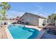 A private backyard pool with a spa, along with a built-in BBQ, ideal for summer entertainment at 628 Carlos Julio Ave, North Las Vegas, NV 89031
