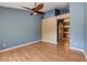 Bedroom with fan, laminate floors, ensuite bathroom and closet at 6540 Angel Mountain Ave, Las Vegas, NV 89130