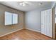 Bright bedroom features laminate flooring, ceiling fan, and ample natural light from the window at 6540 Angel Mountain Ave, Las Vegas, NV 89130