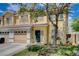 Lovely townhome with a well-maintained lawn, attached garage and a welcoming entrance at 6540 Angel Mountain Ave, Las Vegas, NV 89130