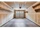 Two-car garage with ample room for parking and storage, featuring built-in shelving at 6540 Angel Mountain Ave, Las Vegas, NV 89130